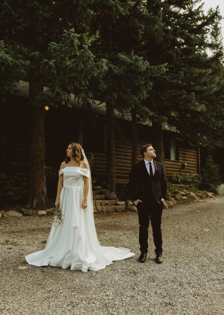 bride and groom photos in the mountains for their cabin elopement at flying moon cabins at flying moon cabins 