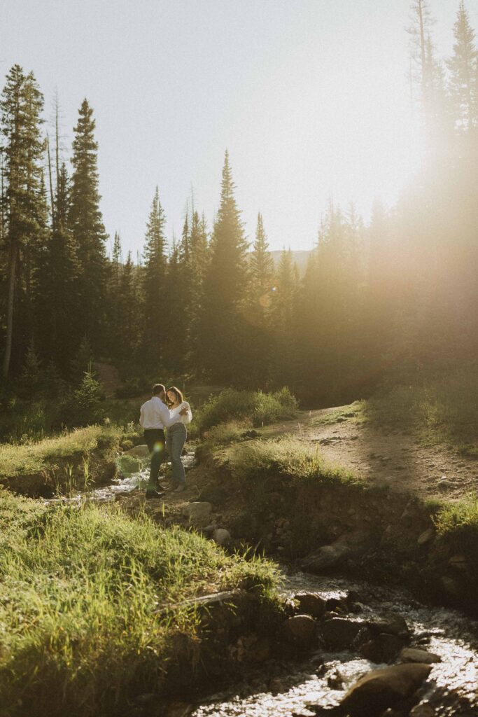 a couple walking up the trail for their engagement photos in Estes Park Colorado
