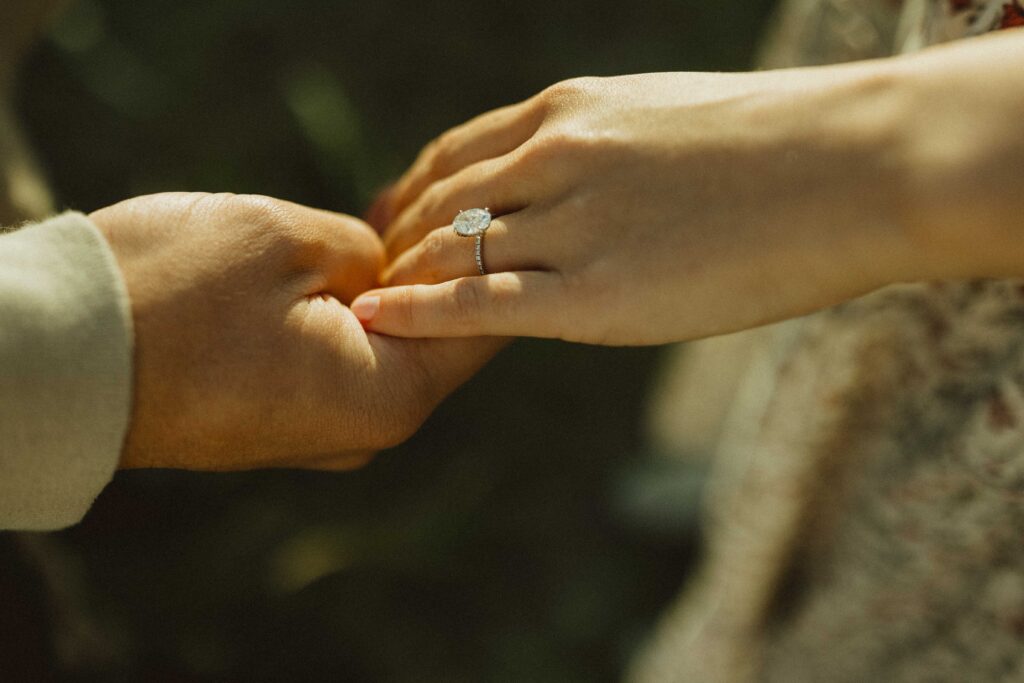 A couples hands for their engagement photos in Estes Park Colorado
