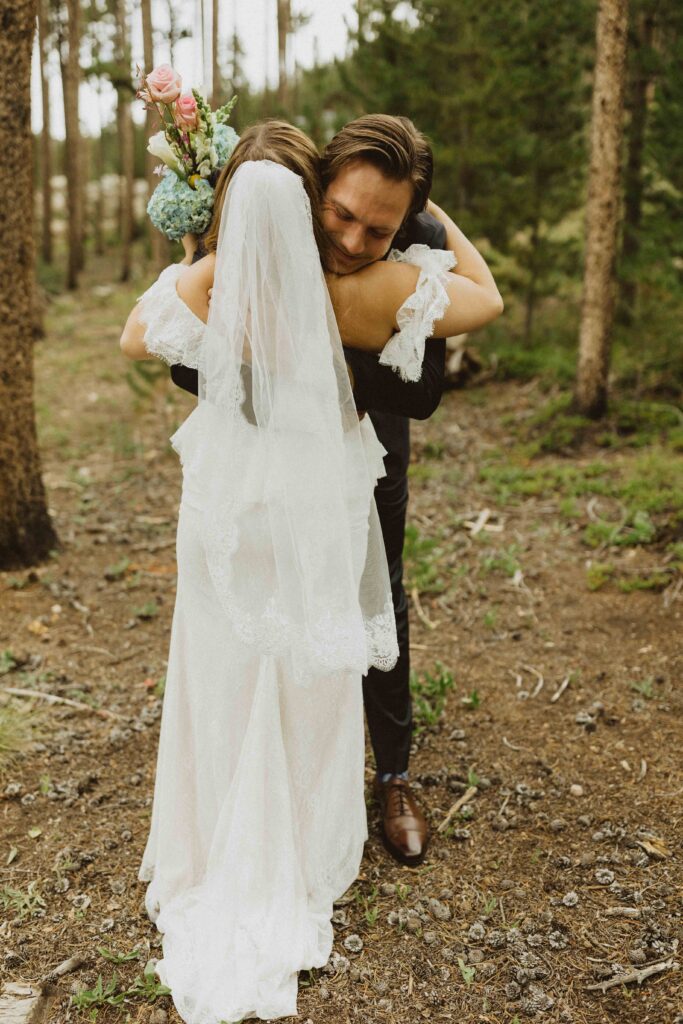mountain wedding couple hugging