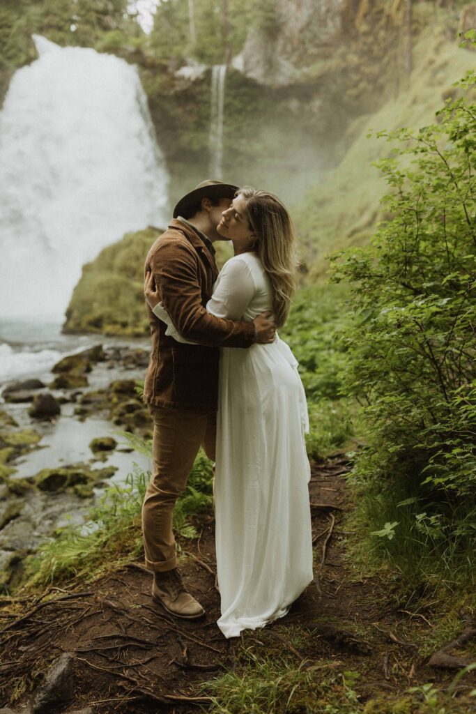 Sahalie Falls Elopement Couple Exploring the Waterfall