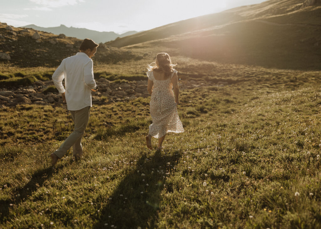 Couple taking destination engagement photos in Rocky Mountain National Park