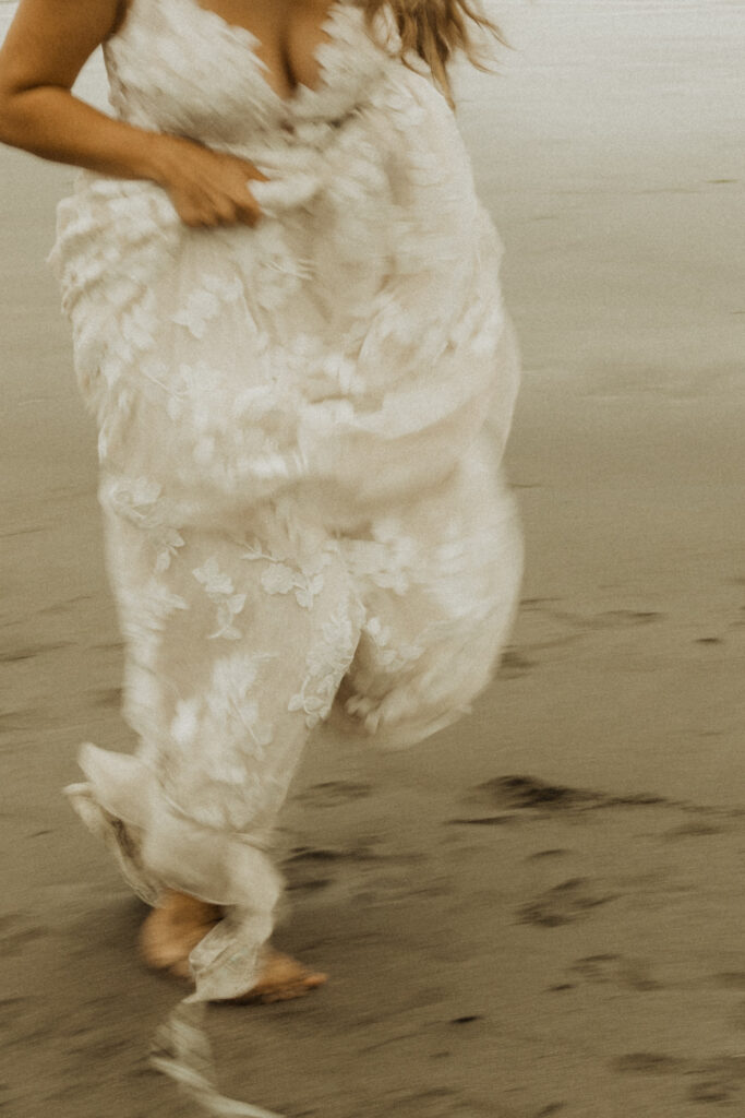 bride running on the brookings oregon beach