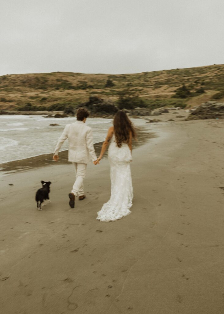 couple with their dog for their brookings oregon beach elopement