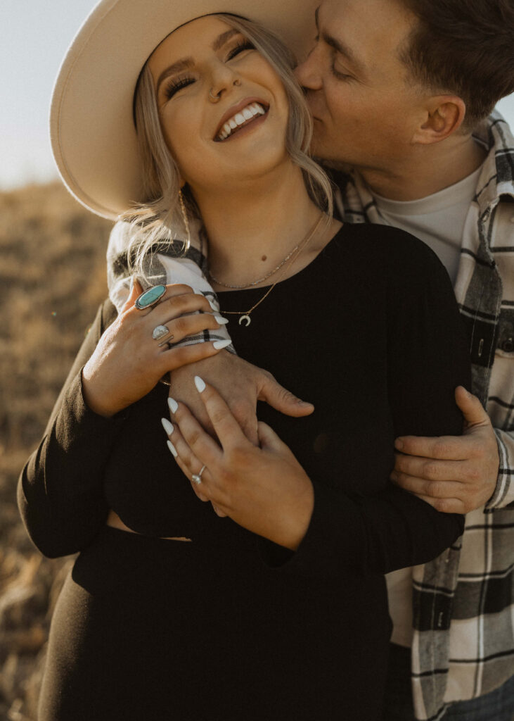 couple smiling for their nebraska engagement photos