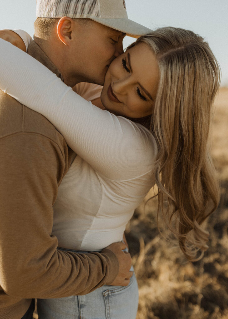 couple kissing for their nebraska engagement photos