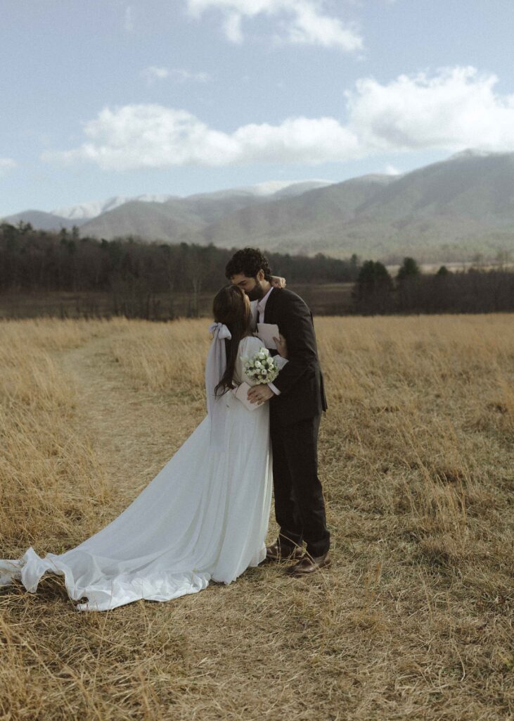 Couple reading their vows at Cades Cove in Great Smoky Mountains National Park