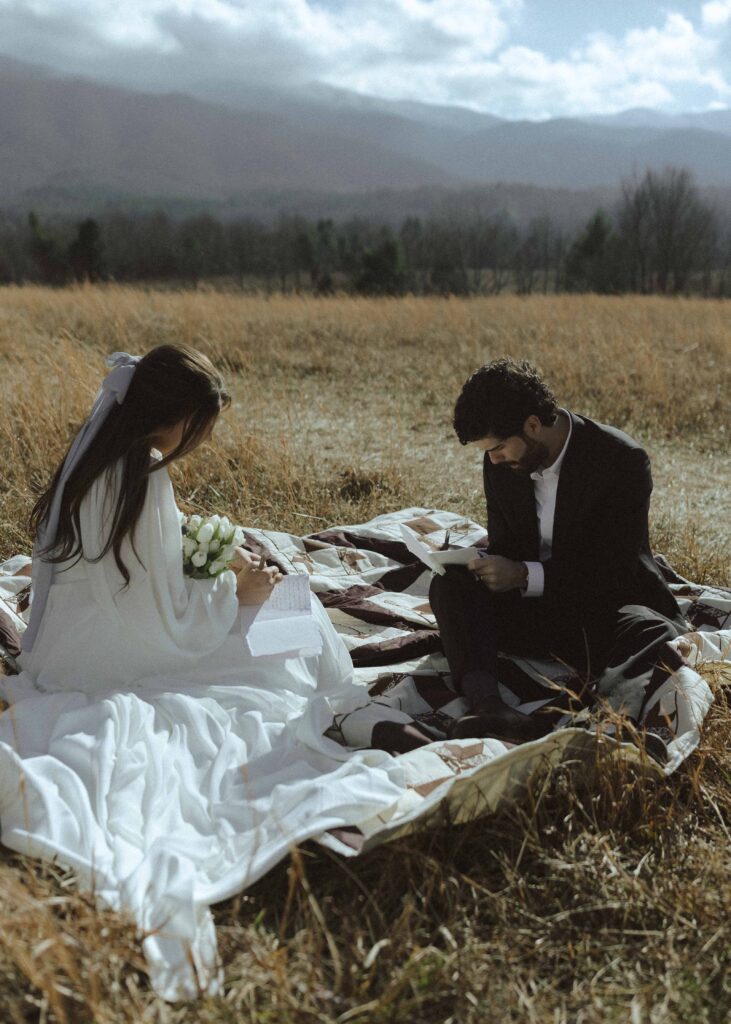 Couple writing their vows at Cades Cove in Great Smoky Mountains National Park