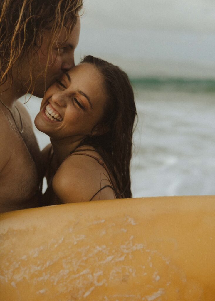 couple smiling during their couples session in kauai 