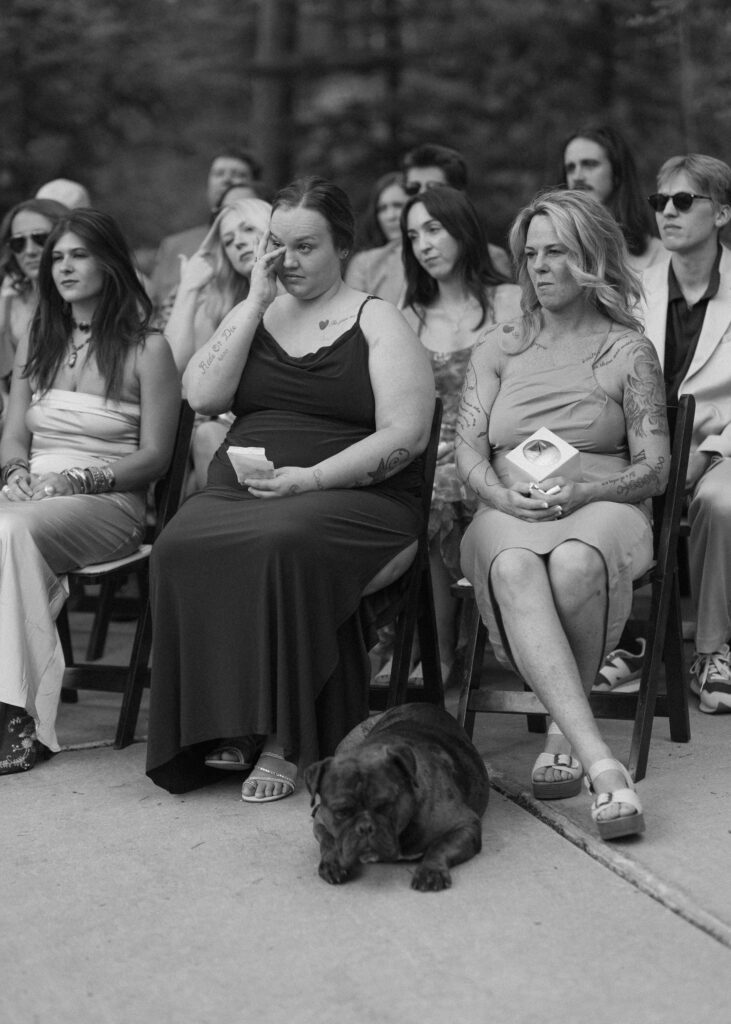 family and friends watching their wedding ceremony