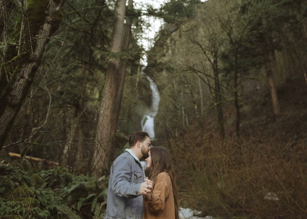 couple taking couples photos at an Oregon waterfall 