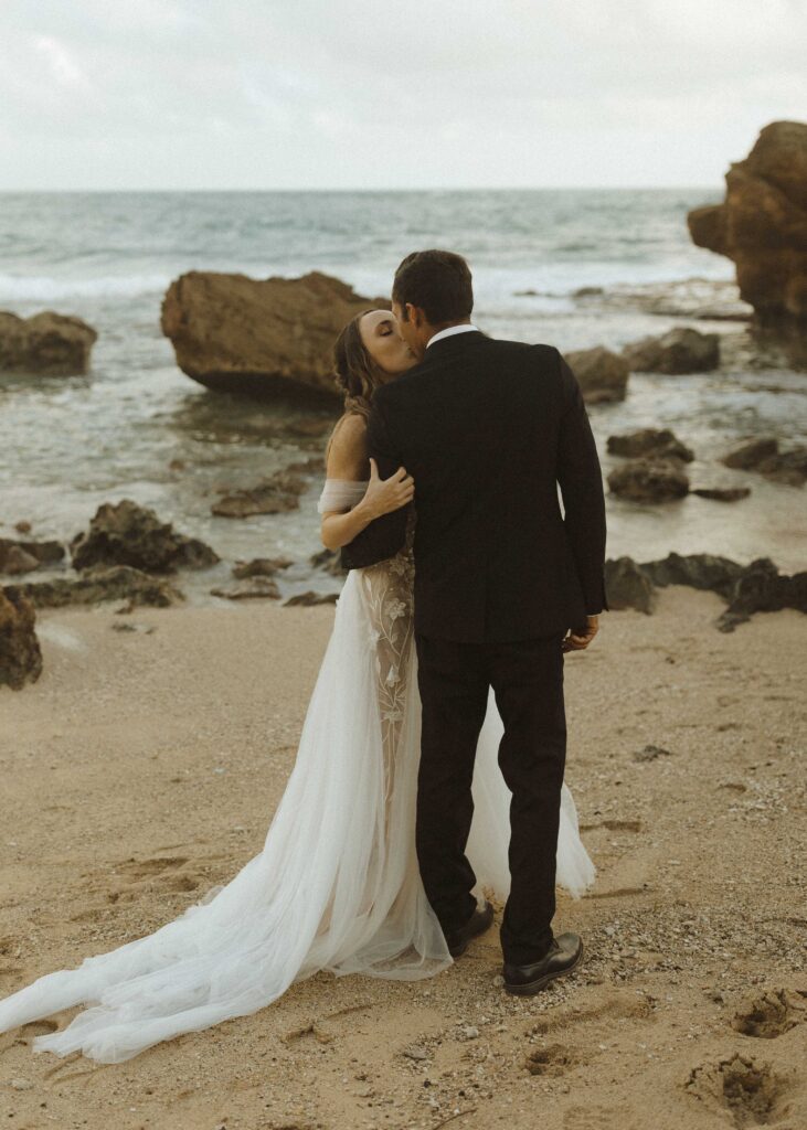 couple walking on the beach for their Kauai Wedding 