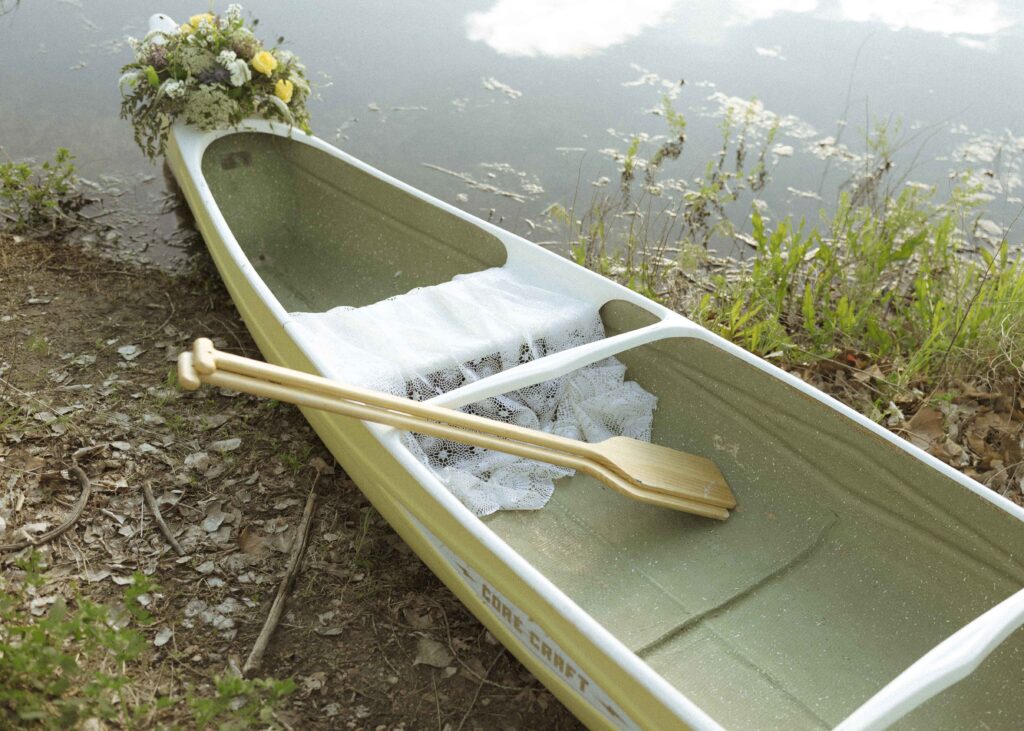 bride and grooms canoe for their canoe elopement 