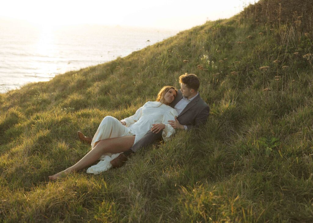 couple laying in the grass for their Oregon wedding
