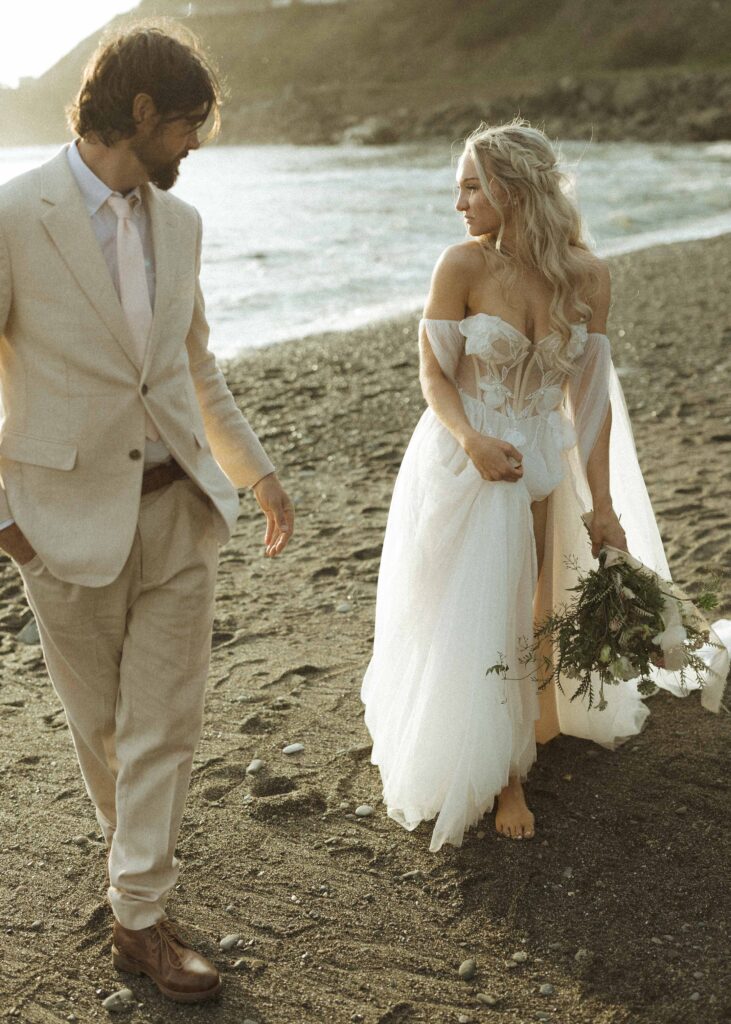 bride and groom taking sunset photos for their brookings oregon elopement 