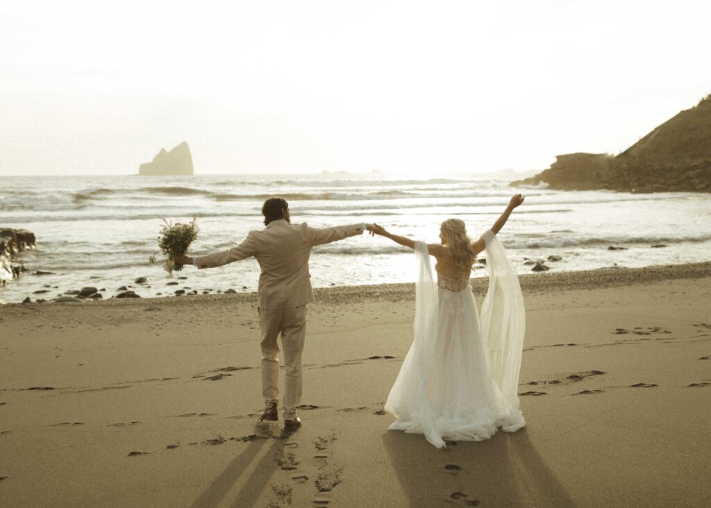 bride and groom taking sunset photos for their brookings oregon elopement 