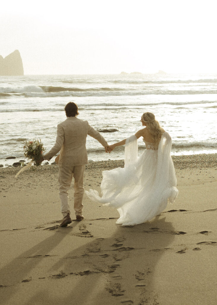 bride and groom taking sunset photos for their brookings oregon elopement 