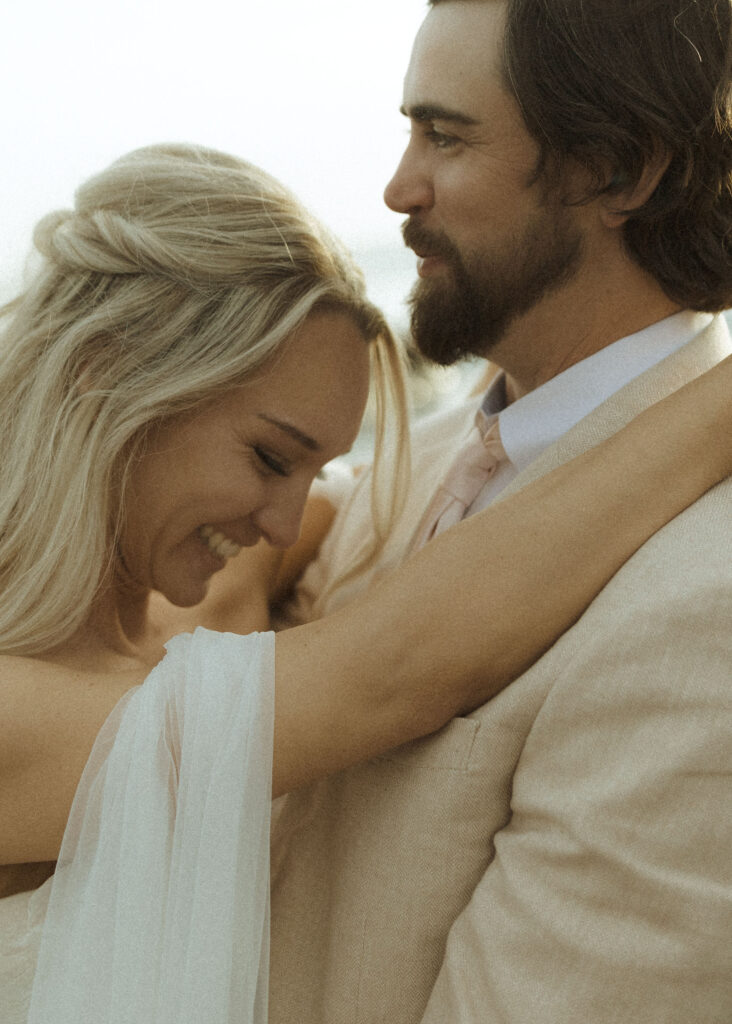 bride and groom taking sunset photos for their brookings oregon elopement 