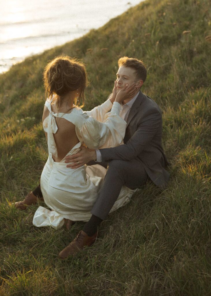 couple laying in the grass for their oregon elopement 