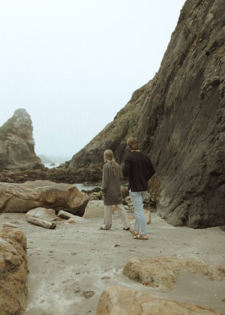 couple walking the beach for their Redwoods Oregon elopement 