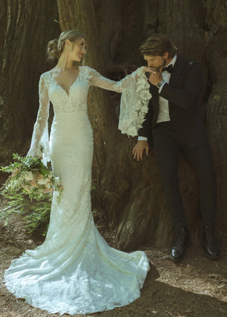 couple taking photos in the Redwoods for their Redwoods Oregon elopement 