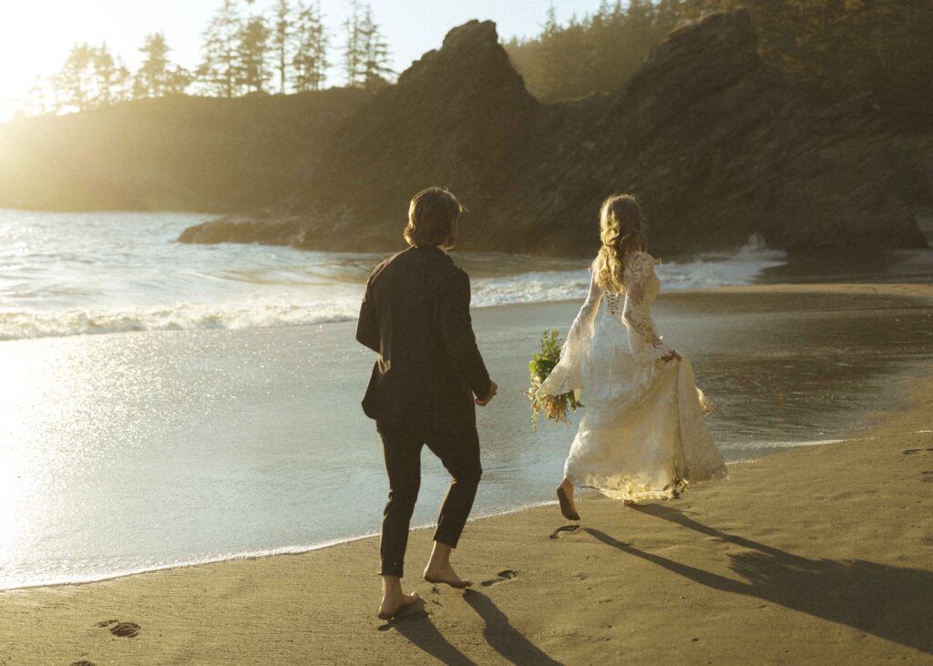 couple running on the beach for their Redwoods Oregon elopement 