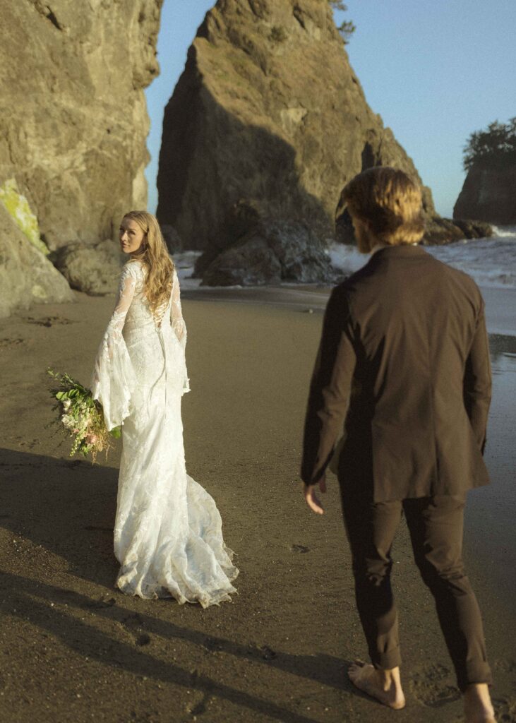 couple walking on the beach for their Redwoods Oregon elopement 