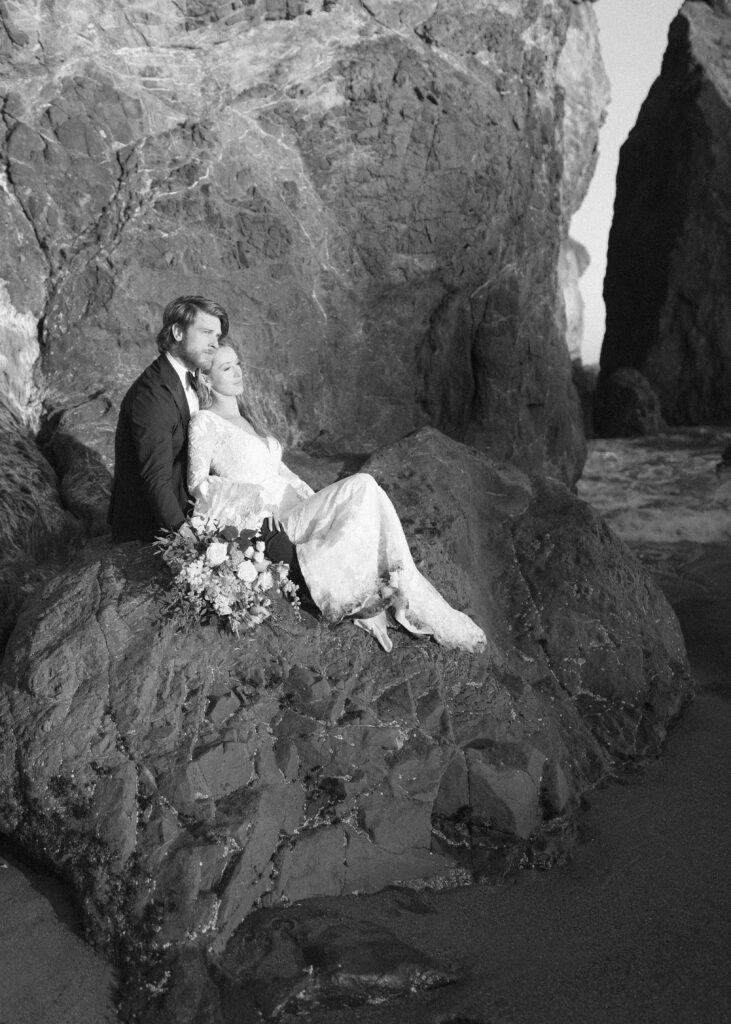 couple taking photos at the beach for their Redwoods Oregon elopement 