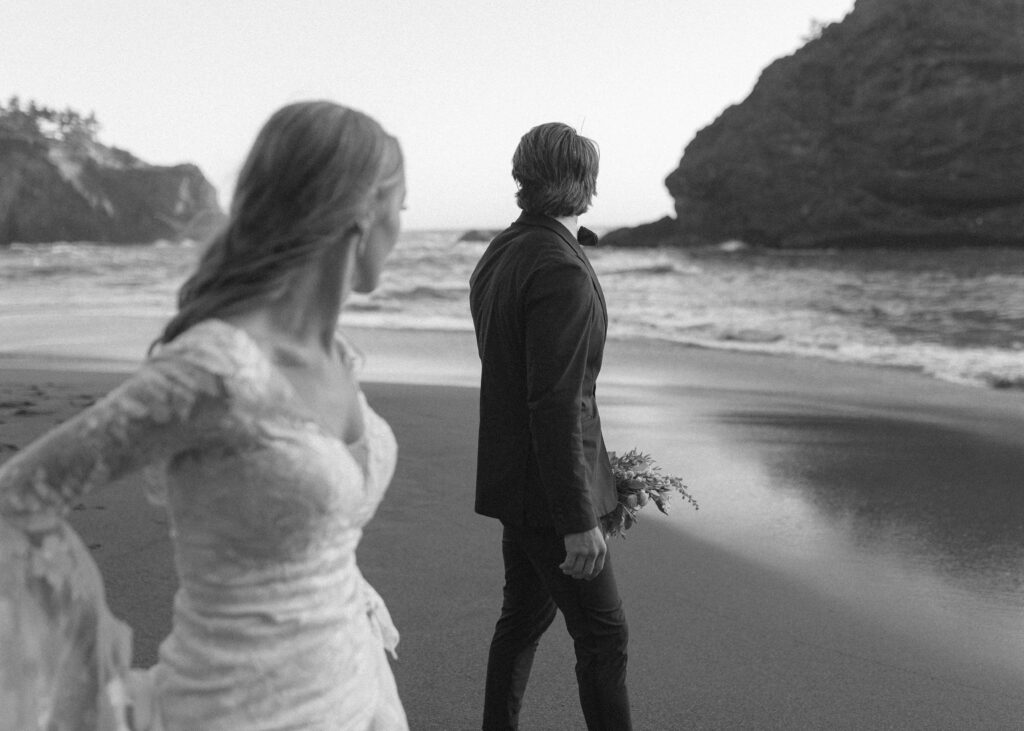 couple running on the beach for their Redwoods Oregon elopement 