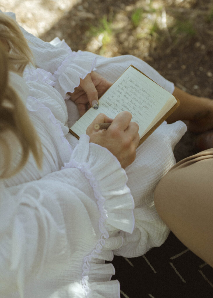 bride writing vows for her mountain view turnout wedding 