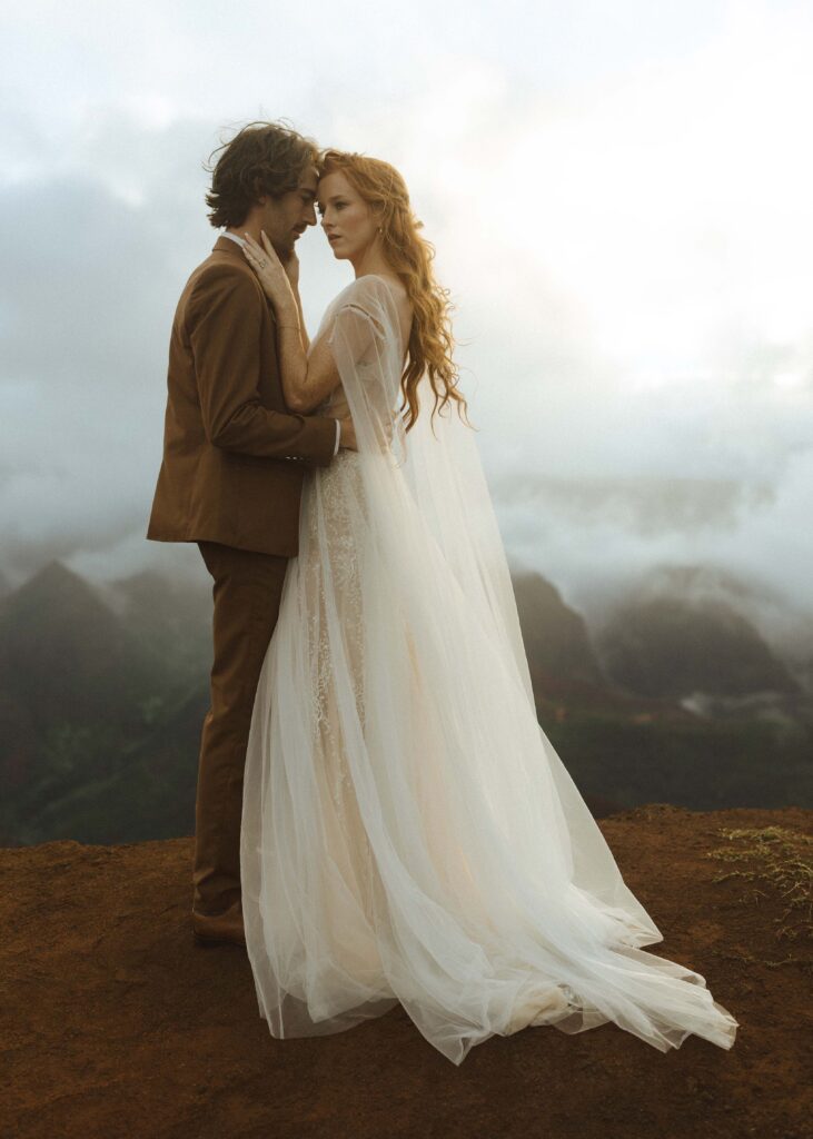 couple walking on waimea canyon for their Kauai elopement 