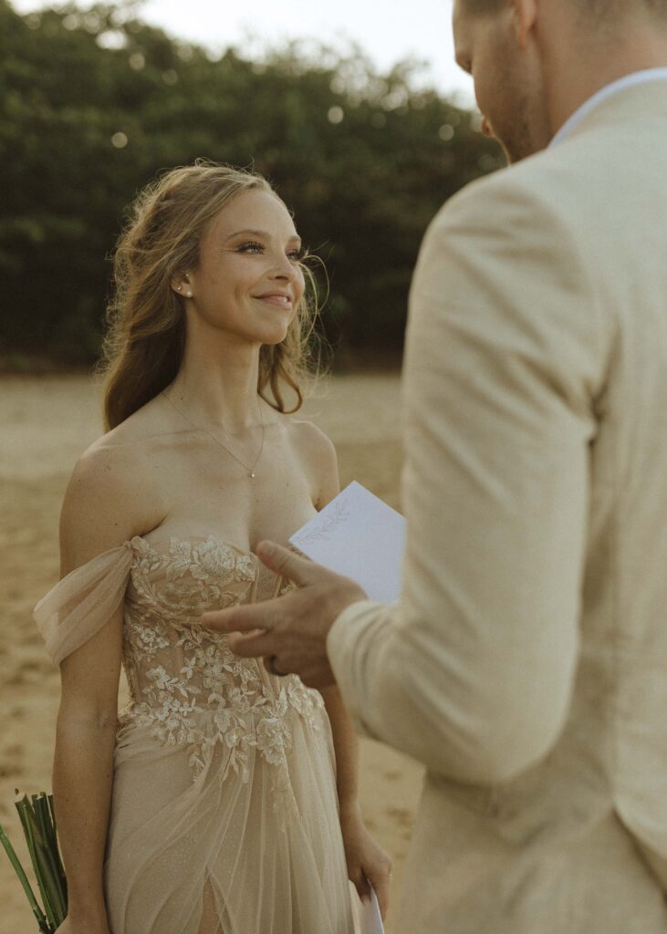 couple reading their vows for their Kauai elopement 