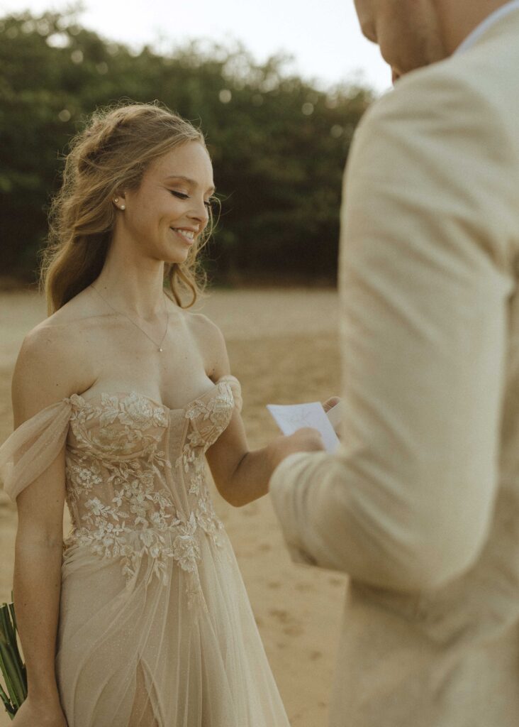 couple reading their vows for their Kauai elopement 