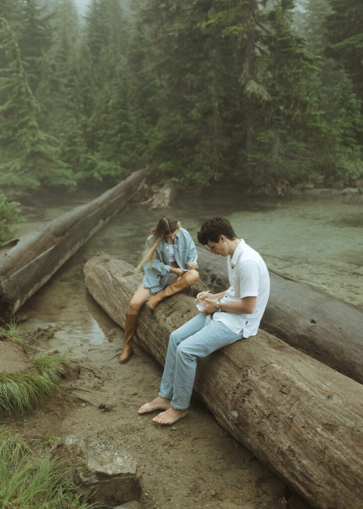 bride and groom writing their vows for their Mowich Lake Elopement in Mt. Rainier National Park 