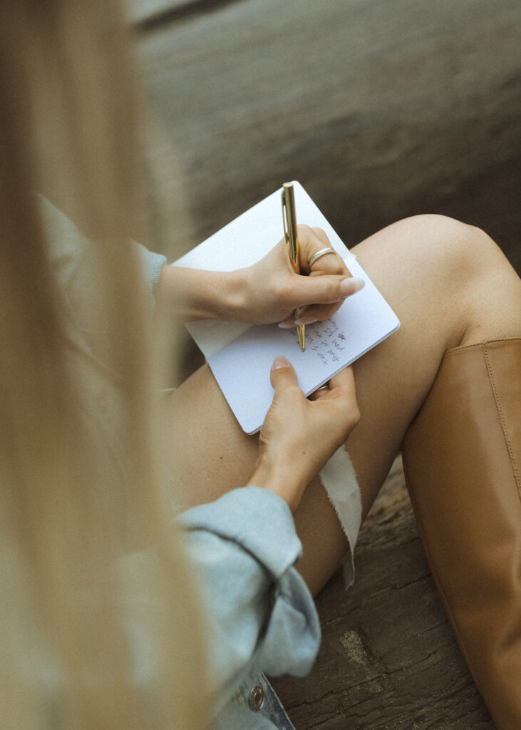 bride writing her vows for their Mowich Lake Elopement in Mt. Rainier National Park 