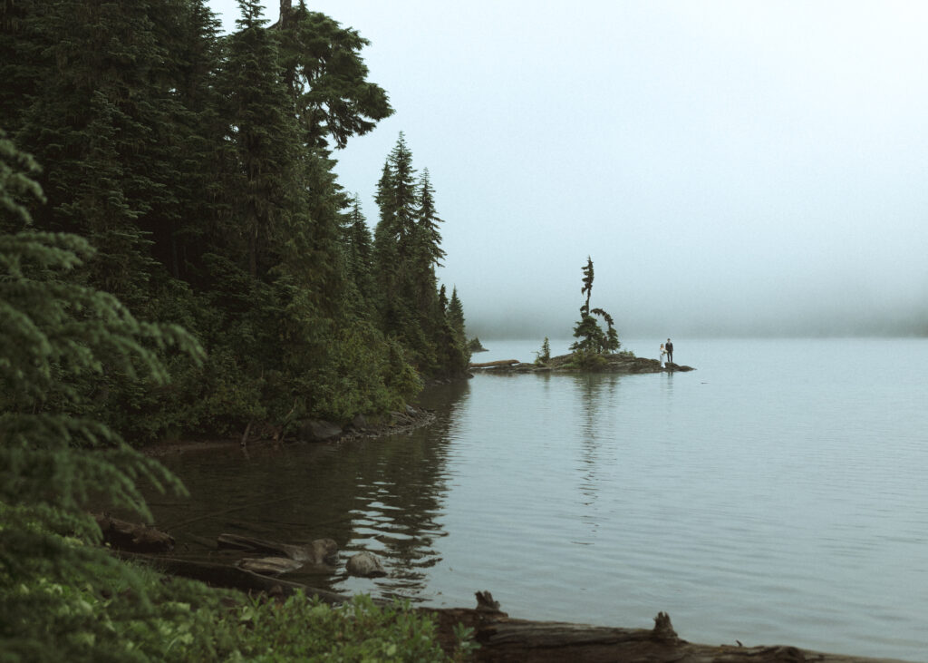 bride and groom taking photos for their Mowich Lake Elopement in Mt. Rainier National Park 