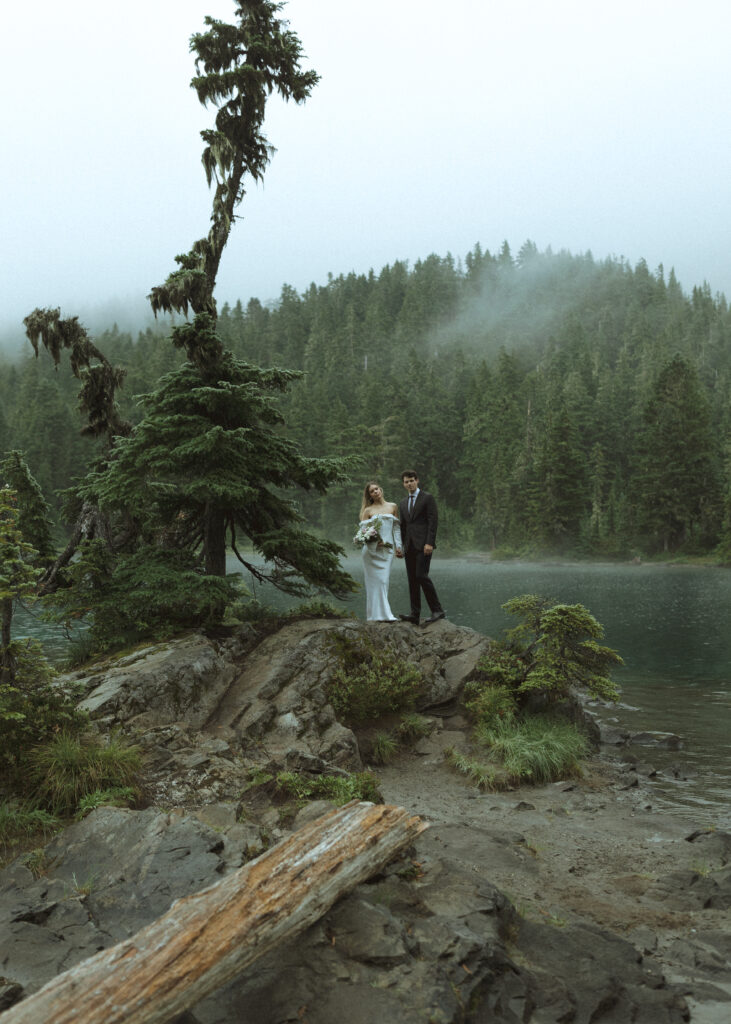 bride and groom taking photos for their Mowich Lake Elopement in Mt. Rainier National Park 