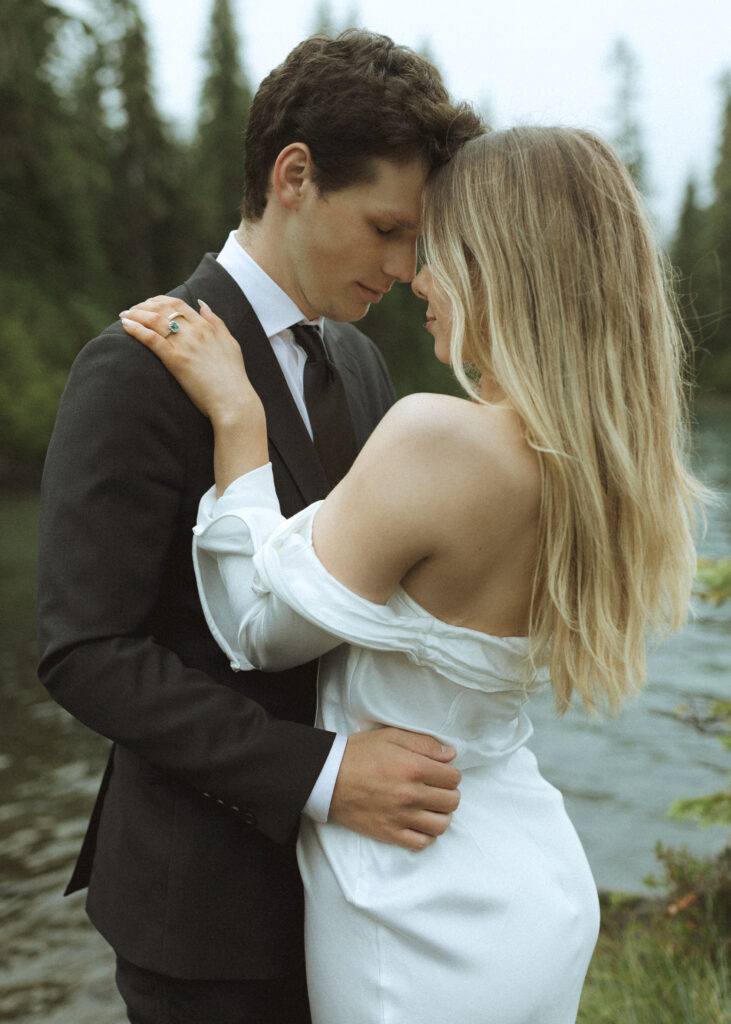 bride and groom taking photos for their Mowich Lake Elopement in Mt. Rainier National Park 