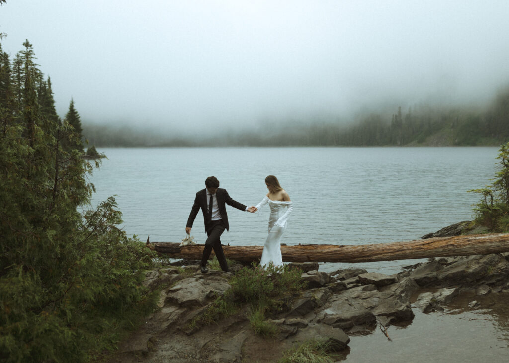 bride and groom taking photos for their Mowich Lake Elopement in Mt. Rainier National Park 