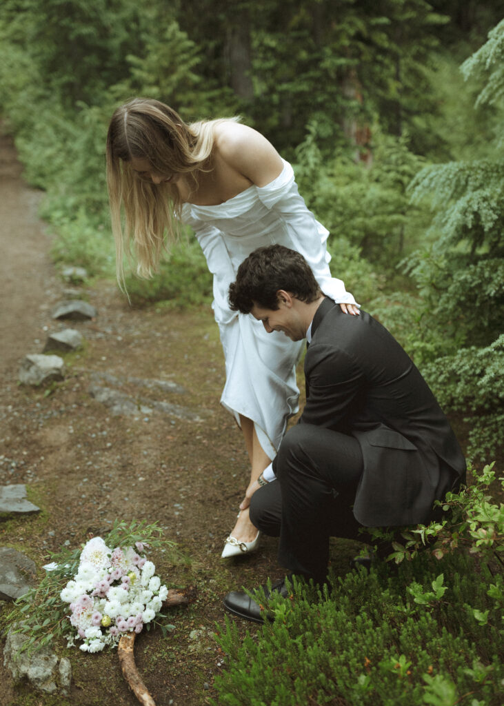 bride and groom taking photos for their Mowich Lake Elopement in Mt. Rainier National Park 