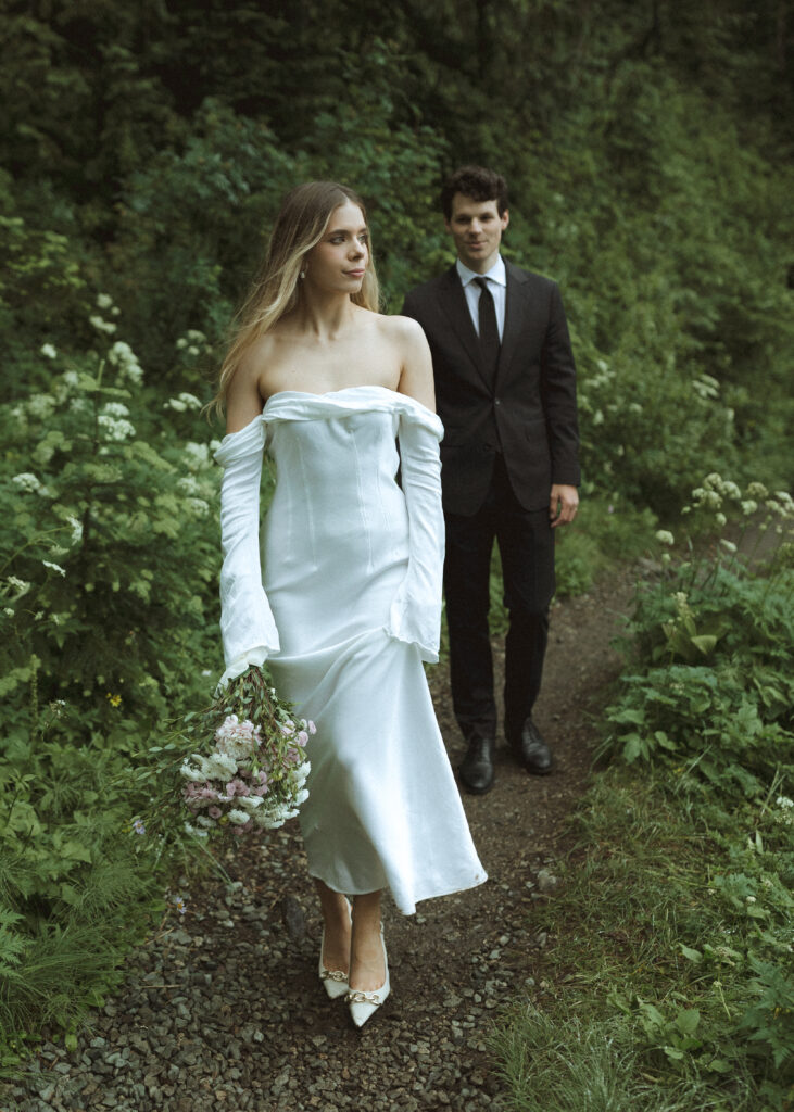 bride and groom taking photos for their Mowich Lake Elopement in Mt. Rainier National Park 