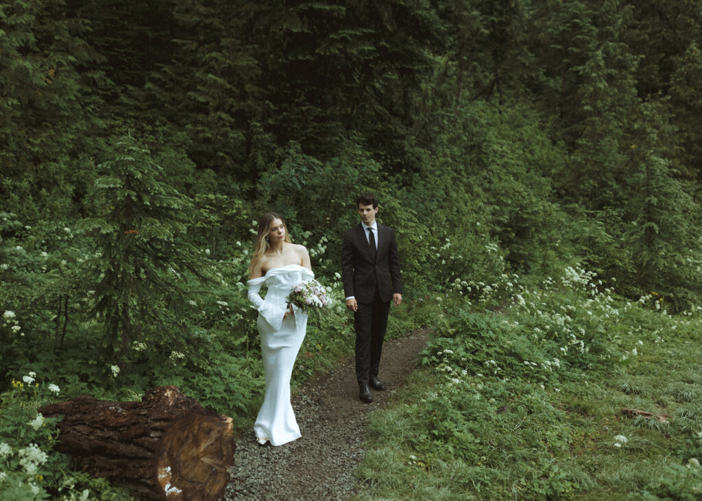 bride and groom taking photos for their Mowich Lake Elopement in Mt. Rainier National Park 