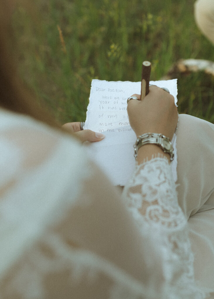 couple writing letters for their anniversary photos at Rocky Mountain National Park 