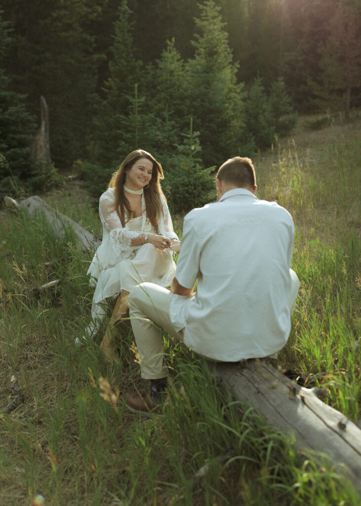 couple posing for their anniversary photos at Rocky Mountain National Park 