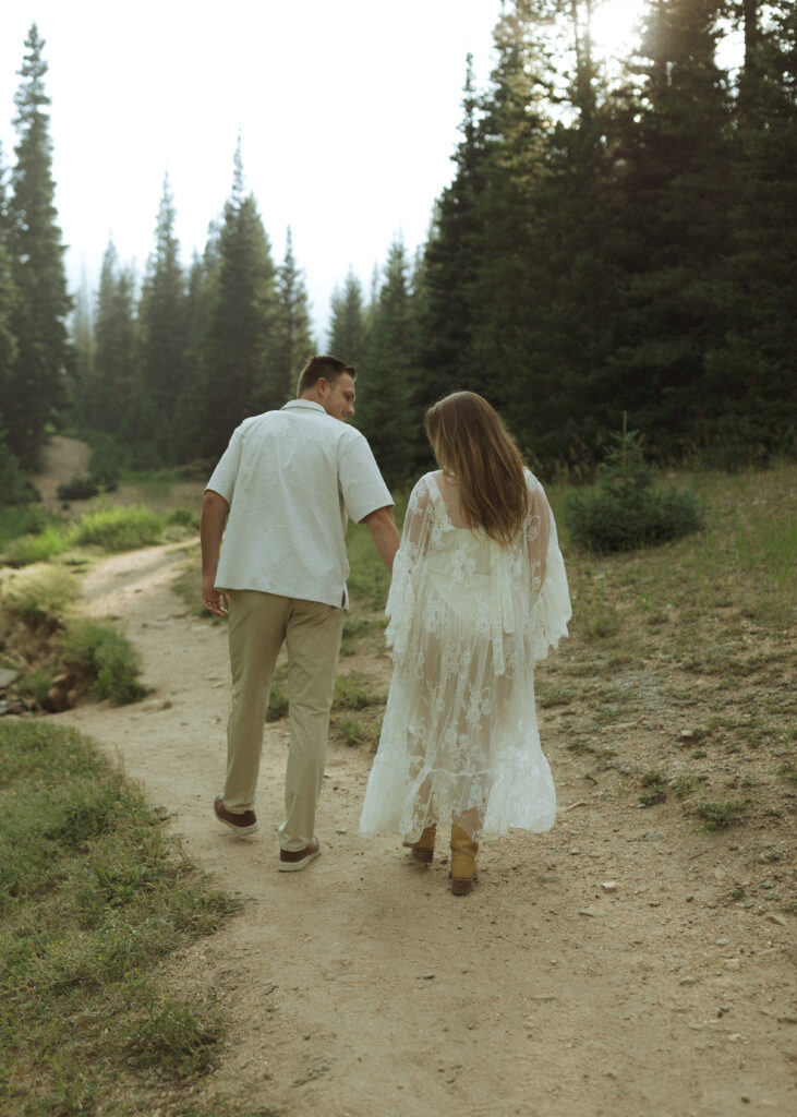 couple walking for their anniversary photos at Rocky Mountain National Park 