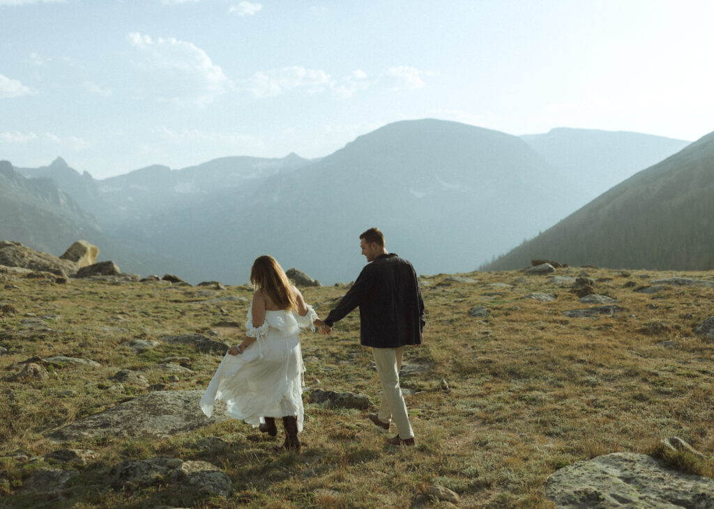 couple walking for their anniversary photos at Rocky Mountain National Park 