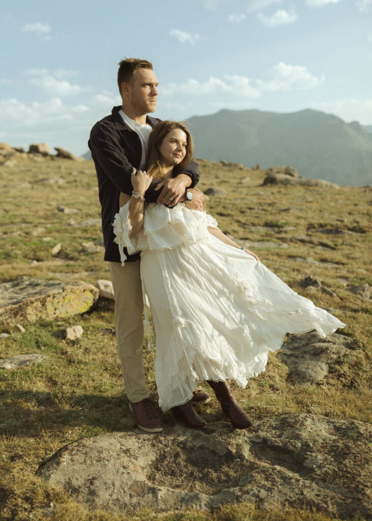 couple posing for their anniversary photos at Rocky Mountain National Park 