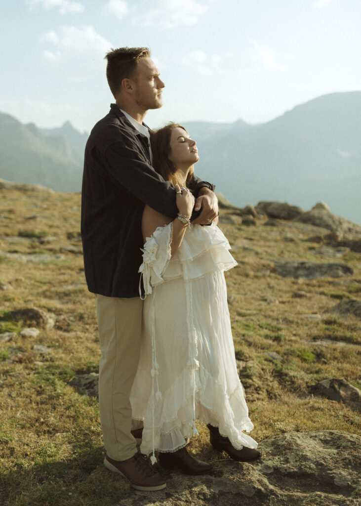 couple posing for their anniversary photos at Rocky Mountain National Park 