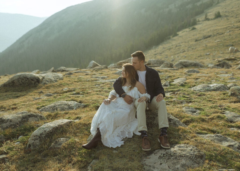 couple posing for their anniversary photos at Rocky Mountain National Park 