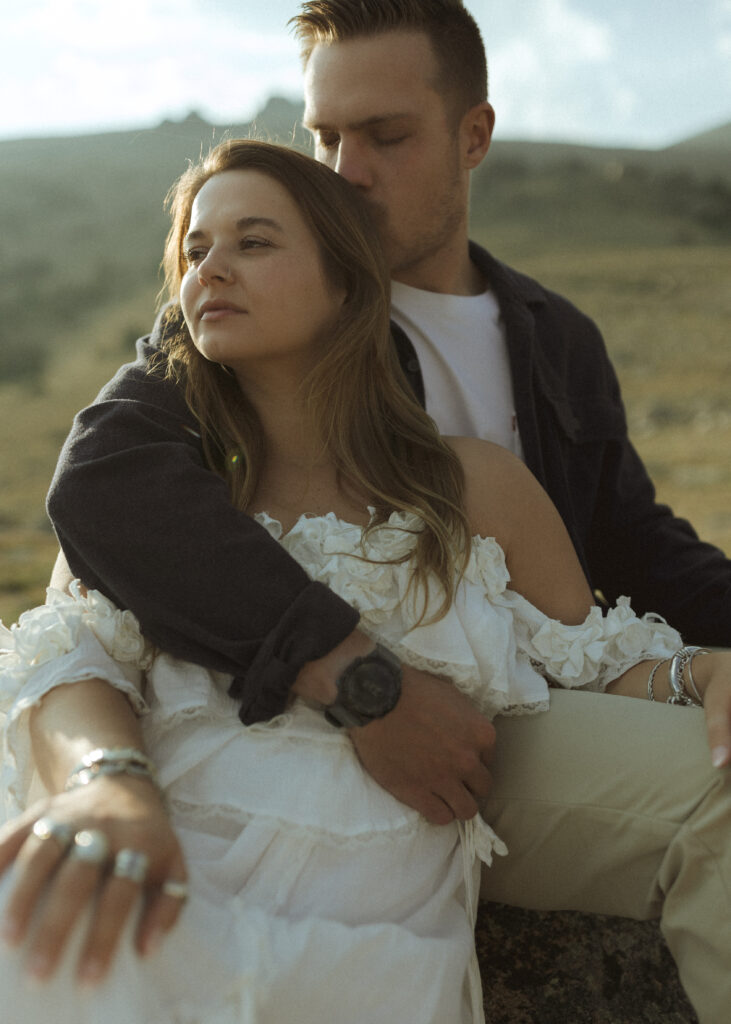 couple posing for their anniversary photos at Rocky Mountain National Park 